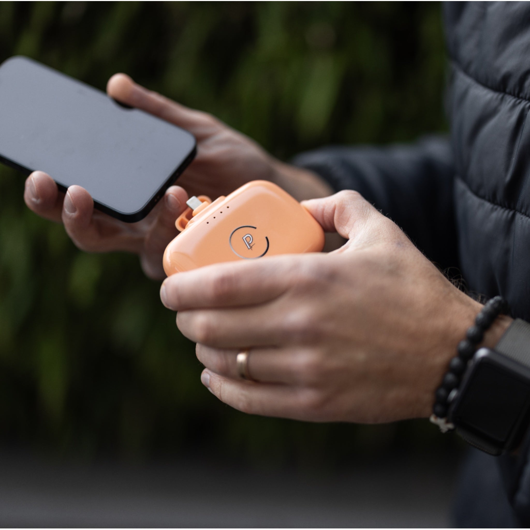 Gravity Portable Charger Charging Phone Shown in Coral Reef