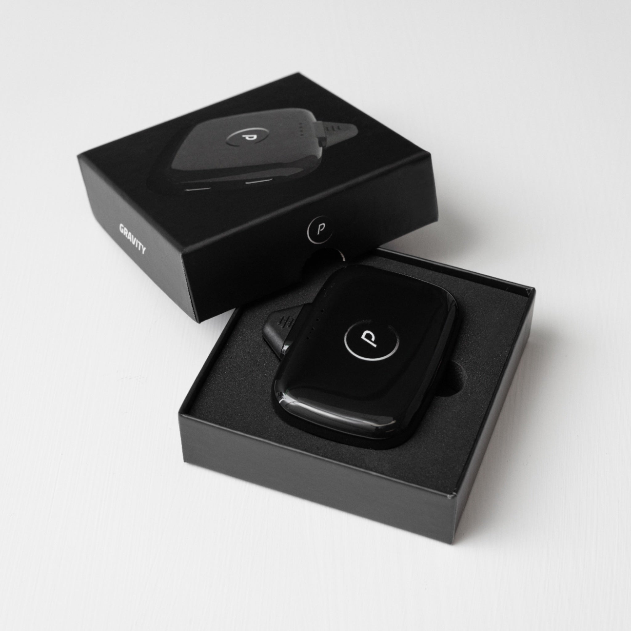 Gravity Portable Charger in Box Shown in Santorini Black